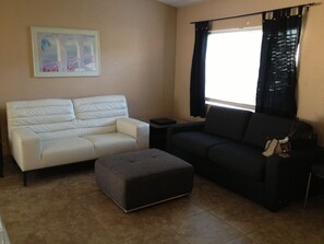 Living room, includes sleeper sofa on the right.
