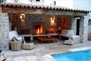 cool poolside lounging by day or cosy fireplace at night