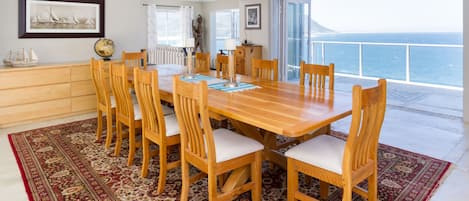 Spacious dining area opening onto a patio with breath taking views