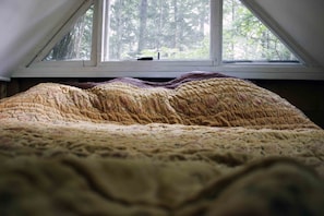 The king size bed in the sleeping loft