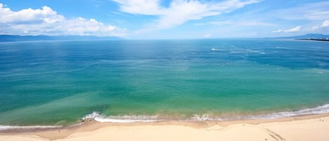 Looking off your balcony over the pool at the bay!