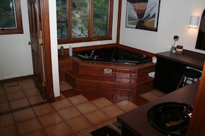 Soaking tub near shower in master bathroom