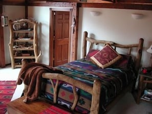 Large master bedroom has windows with a view