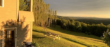 Private entry and grill. A picnic table overlooking the Greens. 