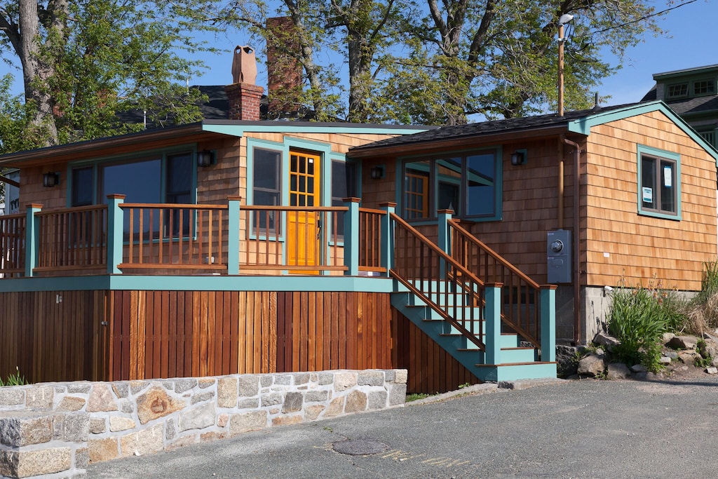 Exterior of cabin with steps and large porch in Rockport, MA.