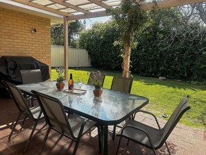 Relax with a BBQ on the back patio 