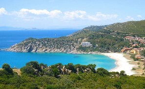 The stunning blue waters of beautiful Solanas beach. 