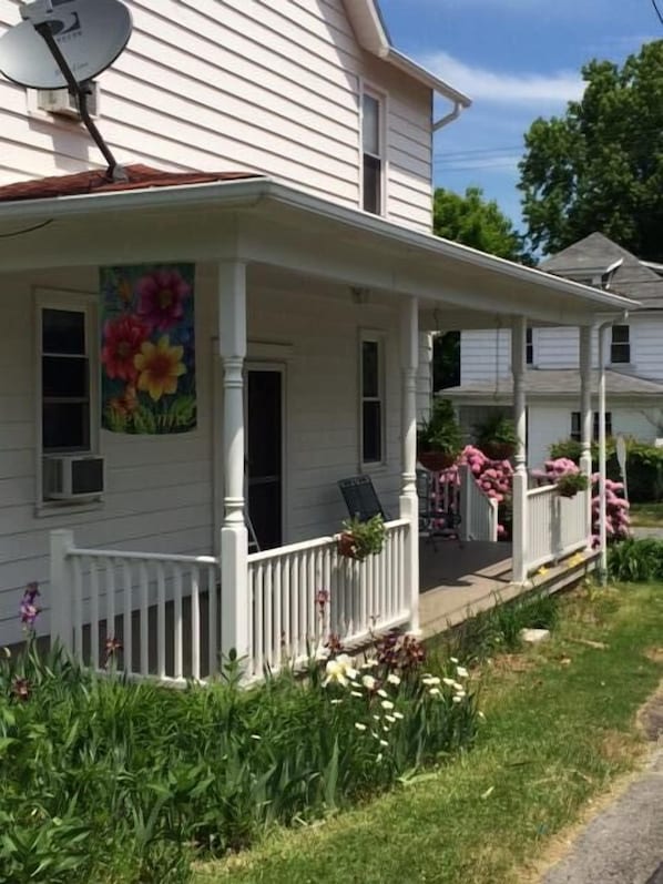 Welcome to Alice's Spring Cottage.  Front porch perfect to watchng the world go