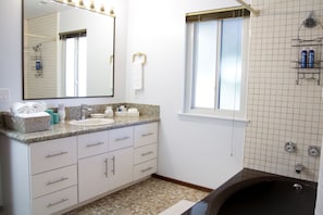  Bright Full Bathroom - Shower & Tub - with a few select amenities.