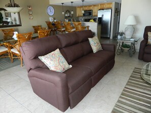 Sofa in the living room with recliners on each end.