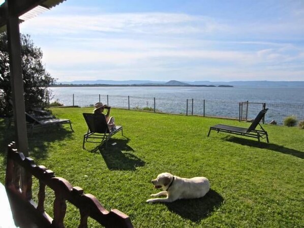 Rear ocean side fenced of yard.