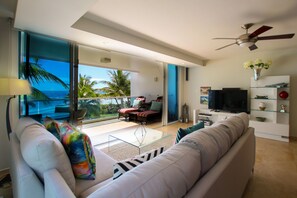Open plan living area has a comfortable L-shaped couch, wifi, apple TV, DVD player and stereo