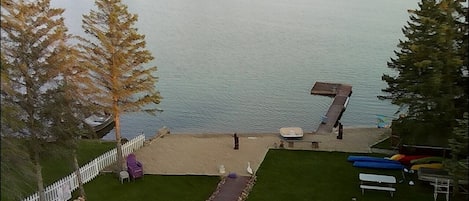 Aerial view of backyard with sandy beach
