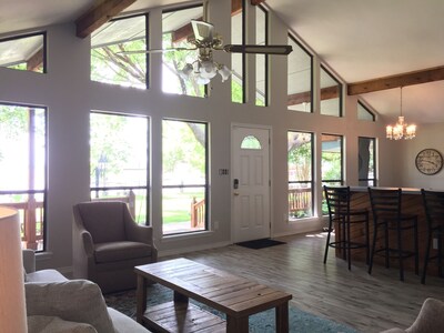 Main living area, open to the kitchen and views of the lake.