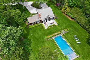 Oversize gunite heated pool with jacuzzi and waterfall