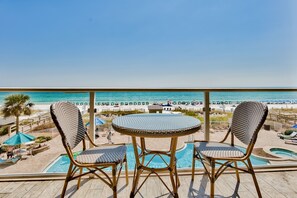 French Bistro set plus bar height Adirondack chairs to enjoy the beach view