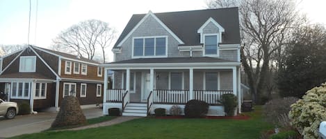 The front, with farmers porch overlooking the water