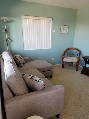 Living room with ocean view - flat screen TV, WiFi, YouTubeTV and Netflix.