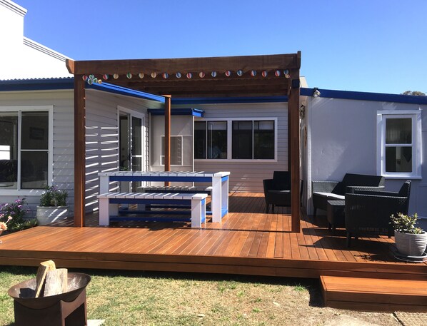 New deck with shaded pergola.