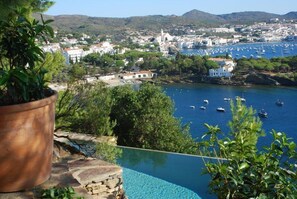 View across pool toward Cadaques