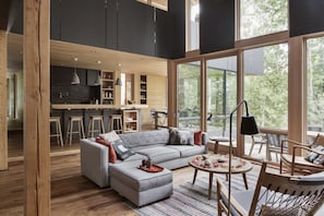 Looking through the Great Room to an open plan breakfast bar and gourmet kitchen