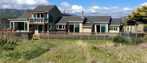 Longshore from beach dunes. The house faces north-west for maximum sunshine.