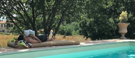 Relaxing by the pool. The pool is connected directly to the house. 