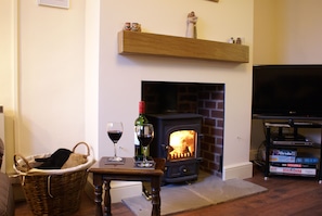 Lounge with cosy log burning stove