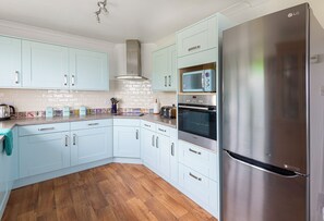 Well equipped kitchen with full sized fridge freezer and dishwasher.