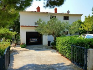 building, garage, entrance to the kitchen