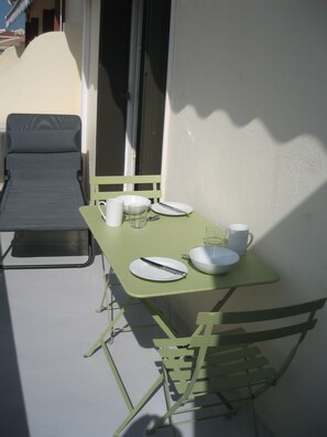 balcony set for breakfast in the sun