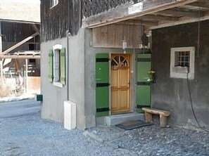 Front door and parking area of apartment la Verney