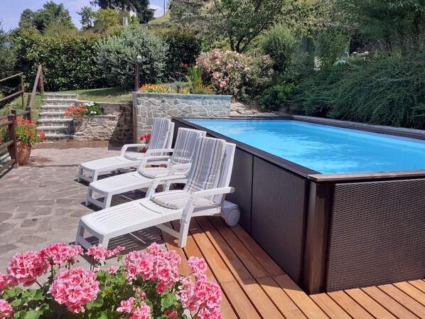 Swimming pool and terrace area with a view