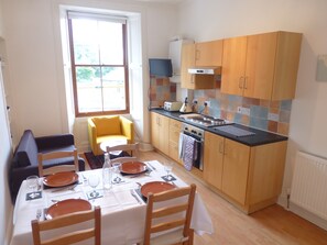 The living room with dining table