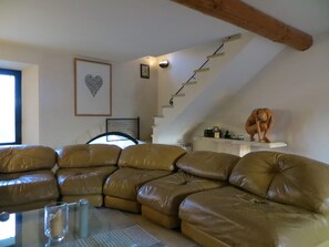 Living room looking onto the open  staircase