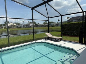 Fly-screened lanai & pool deck. (Child pool safety fence rolled back to sides)