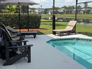 Inviting pool and deck area, relax on loungers and adirondacks.