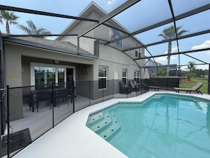 Pool safety fence in position (posts lift out to roll fence back to sides)
