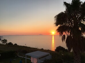 Sunset view stromboli from villa palummo garden