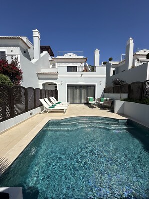 South facing pool area (sunny all day) with loungers and comfortable seating 