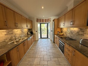 Galley kitchen with Siemens appliances and Nespresso coffee machine 
