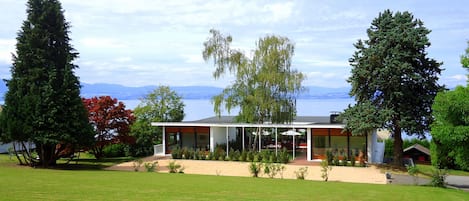 Mid Century Modern Villa with Lake Views, surrounded by large garden