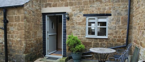 Entrance to cottage and patio area