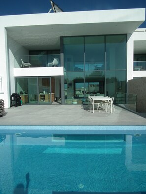 Pool (with window into play room on grond floor) & BBQ Entertainment area