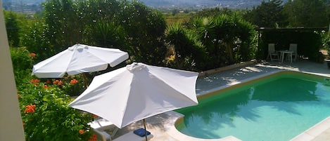 Pool, garden and hills.