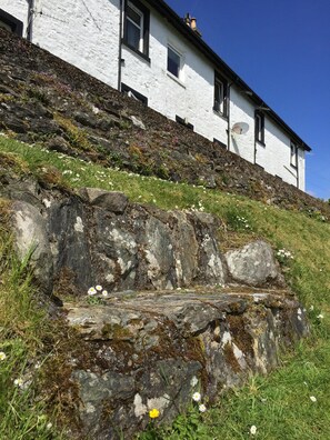 old stone seat in lower front garden area