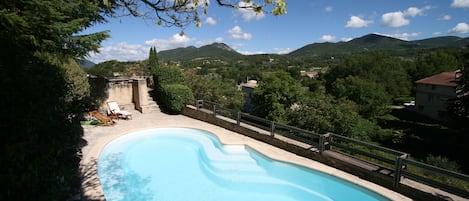 The pool in summer, with 900m hills in the background