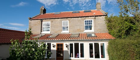 View of the back of Grange Farm and the garden.