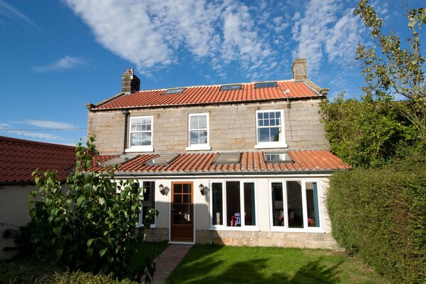 View of the back of Grange Farm and the garden.