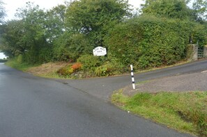 Farm and cottage entrance from road